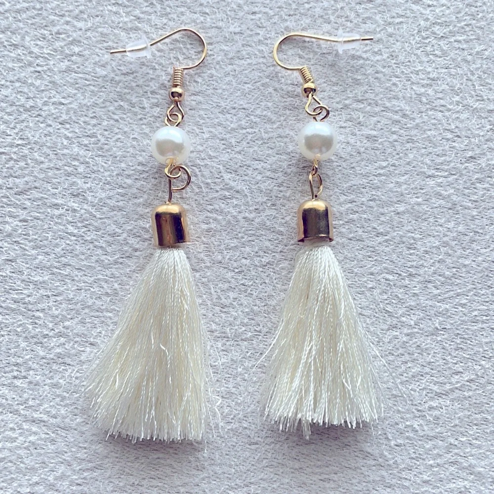 Pearl earrings with white tassel